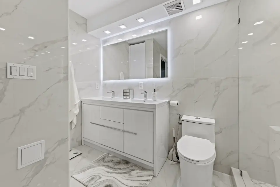 Finished bathroom with tile and fixtures